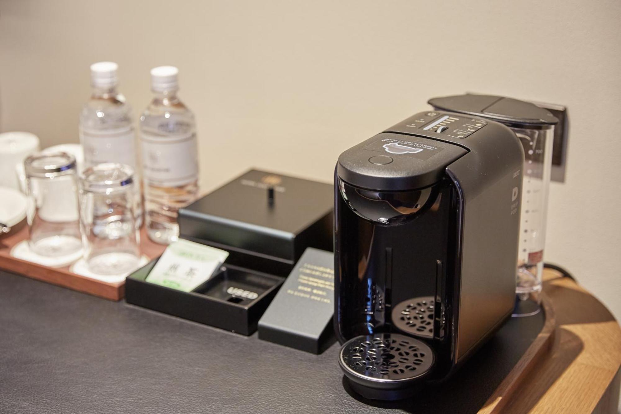 נאהא Hotel Collective מראה חיצוני תמונה A Nespresso VertuoLine coffee machine