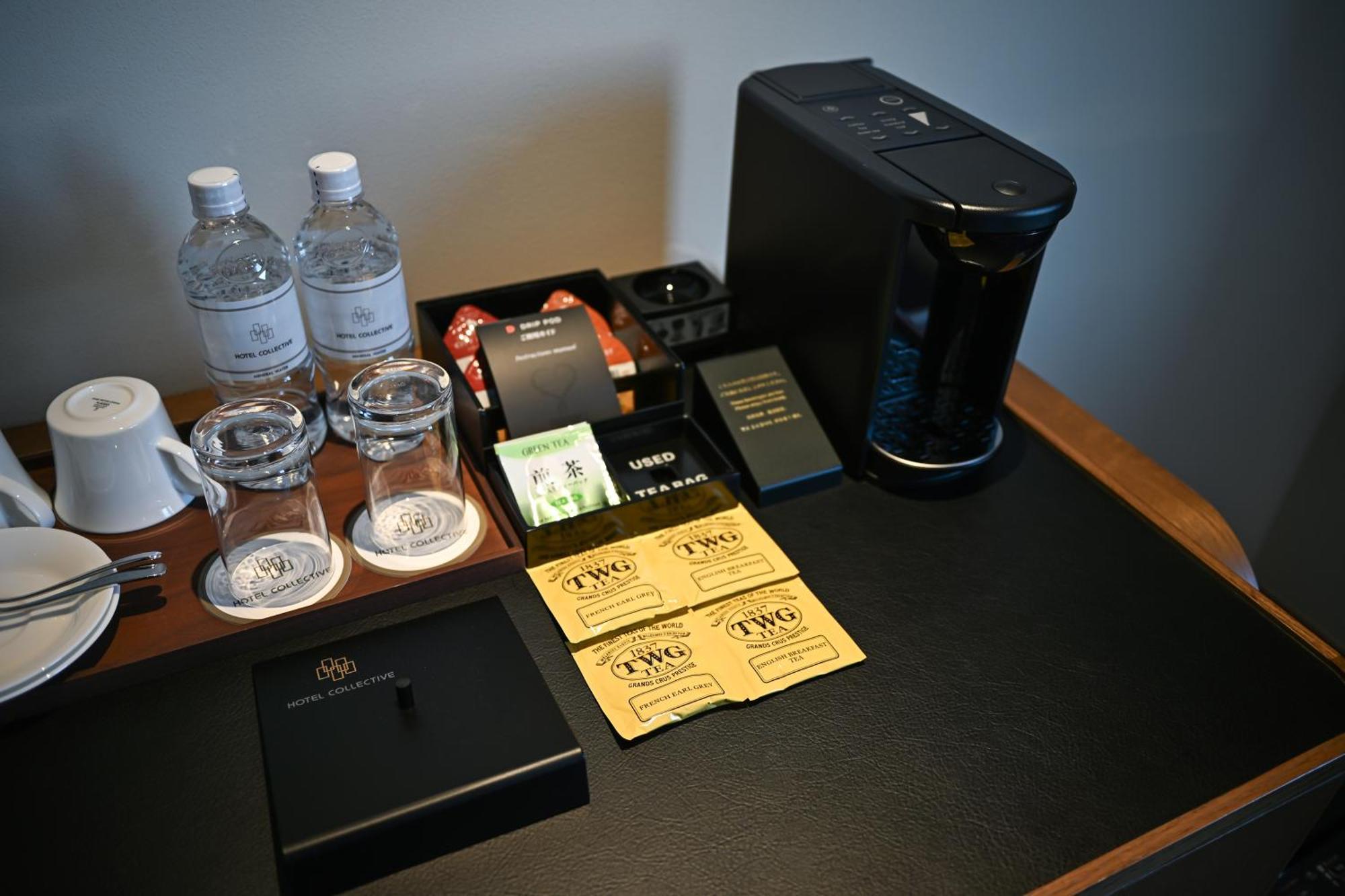 נאהא Hotel Collective מראה חיצוני תמונה A Nespresso coffee machine in a hotel room
